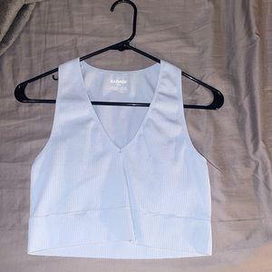 I am selling this cute tank from the store Garage!! It fits true to size.